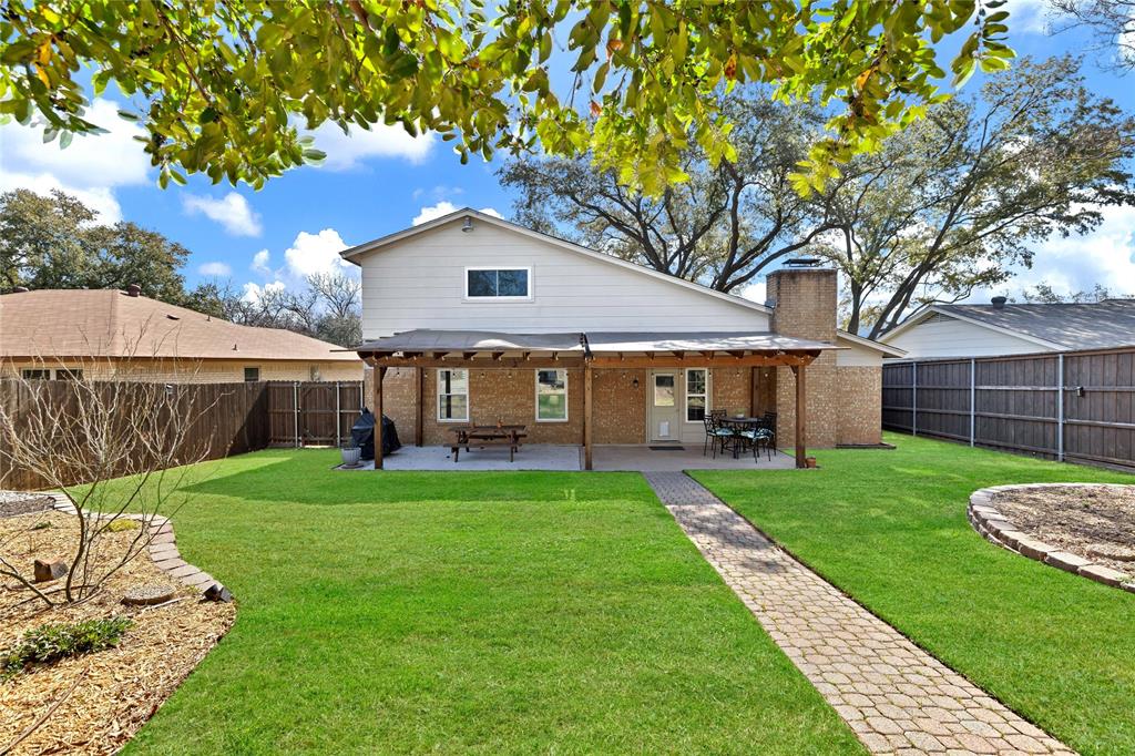 2609 Quail Ridge Irving, TX 75060 - Photo 32 of 39 a front view of a house with garden