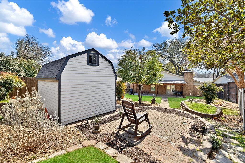 2609 Quail Ridge Irving, TX 75060 - Photo 33 of 39 a view of a backyard with furniture and a fire pit