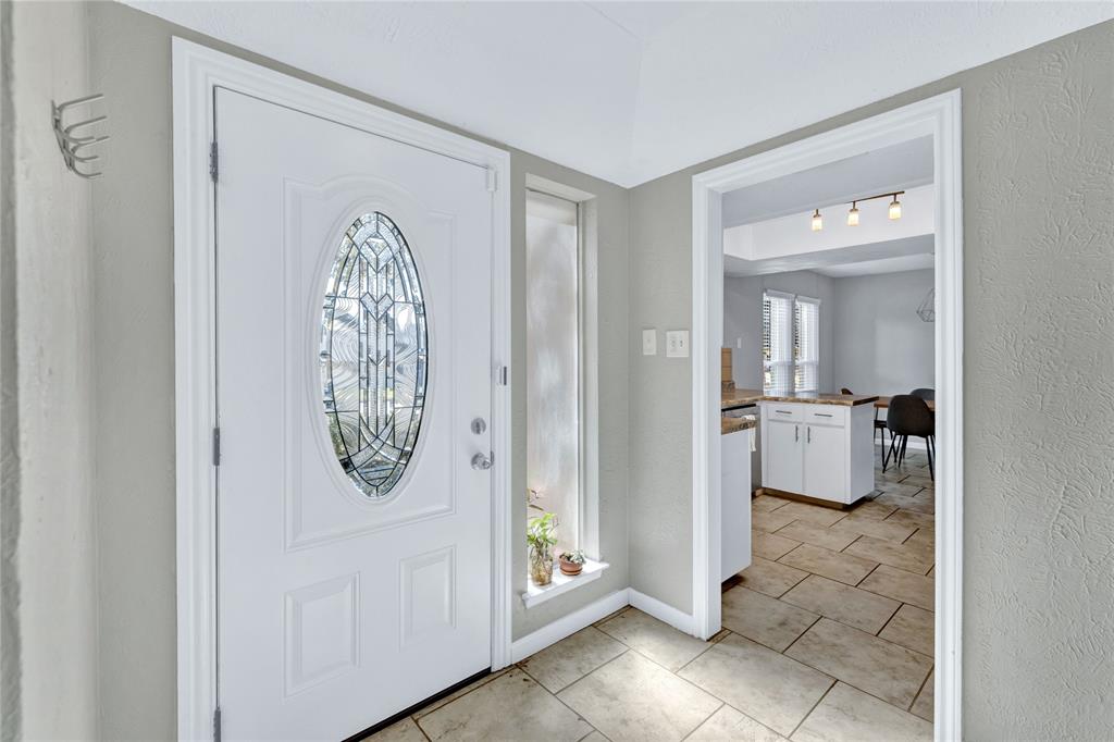 2609 Quail Ridge Irving, TX 75060 - Photo 5 of 39 a view of a hallway with washer and dryer