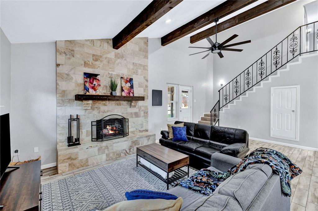2609 Quail Ridge Irving, TX 75060 - Photo 8 of 39 a living room with furniture and a fireplace