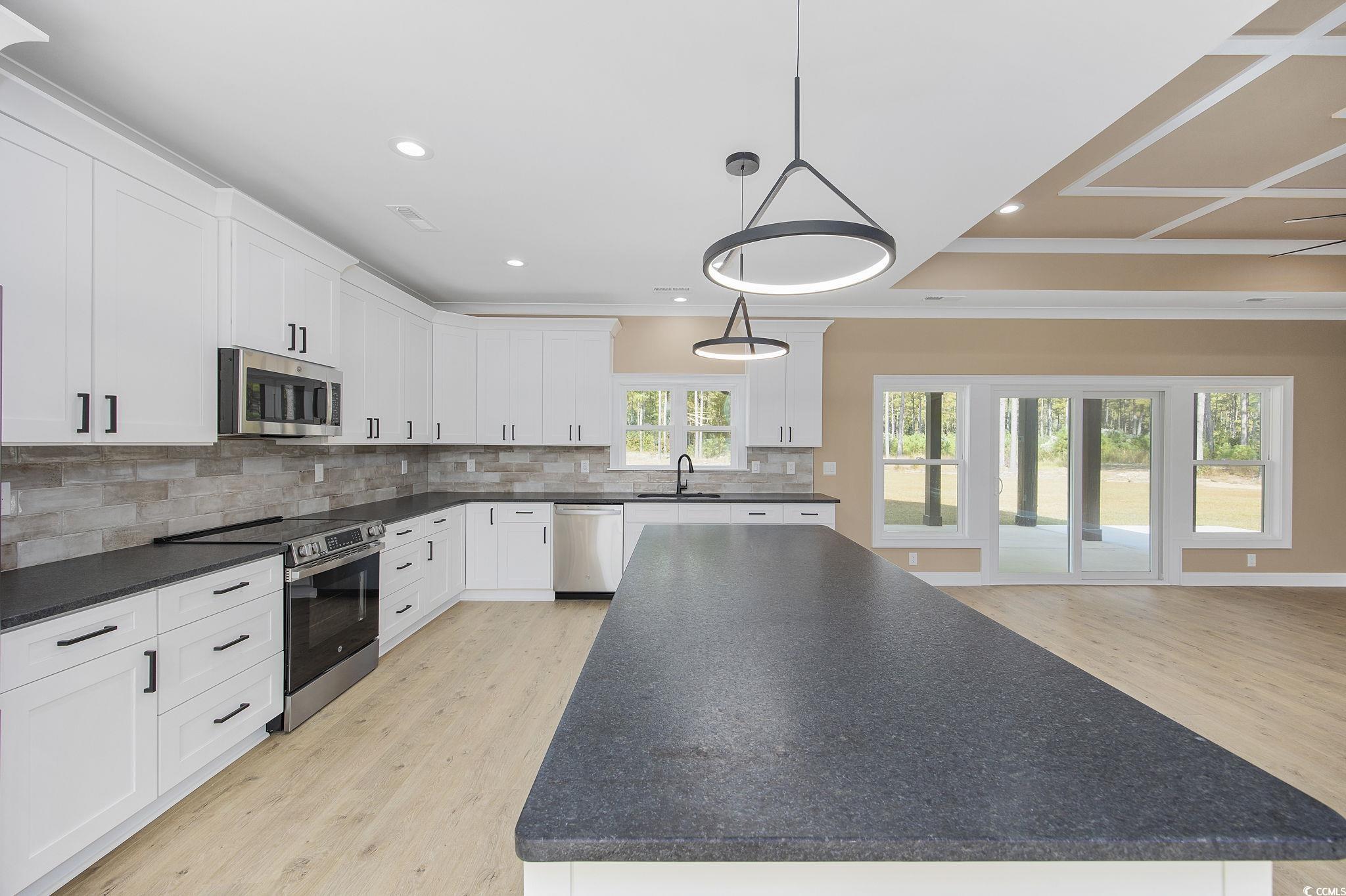 6914 Pauley Swamp Road Conway, SC 29527 - Photo 14 of 40 Kitchen with a healthy amount of sunlight, stainle