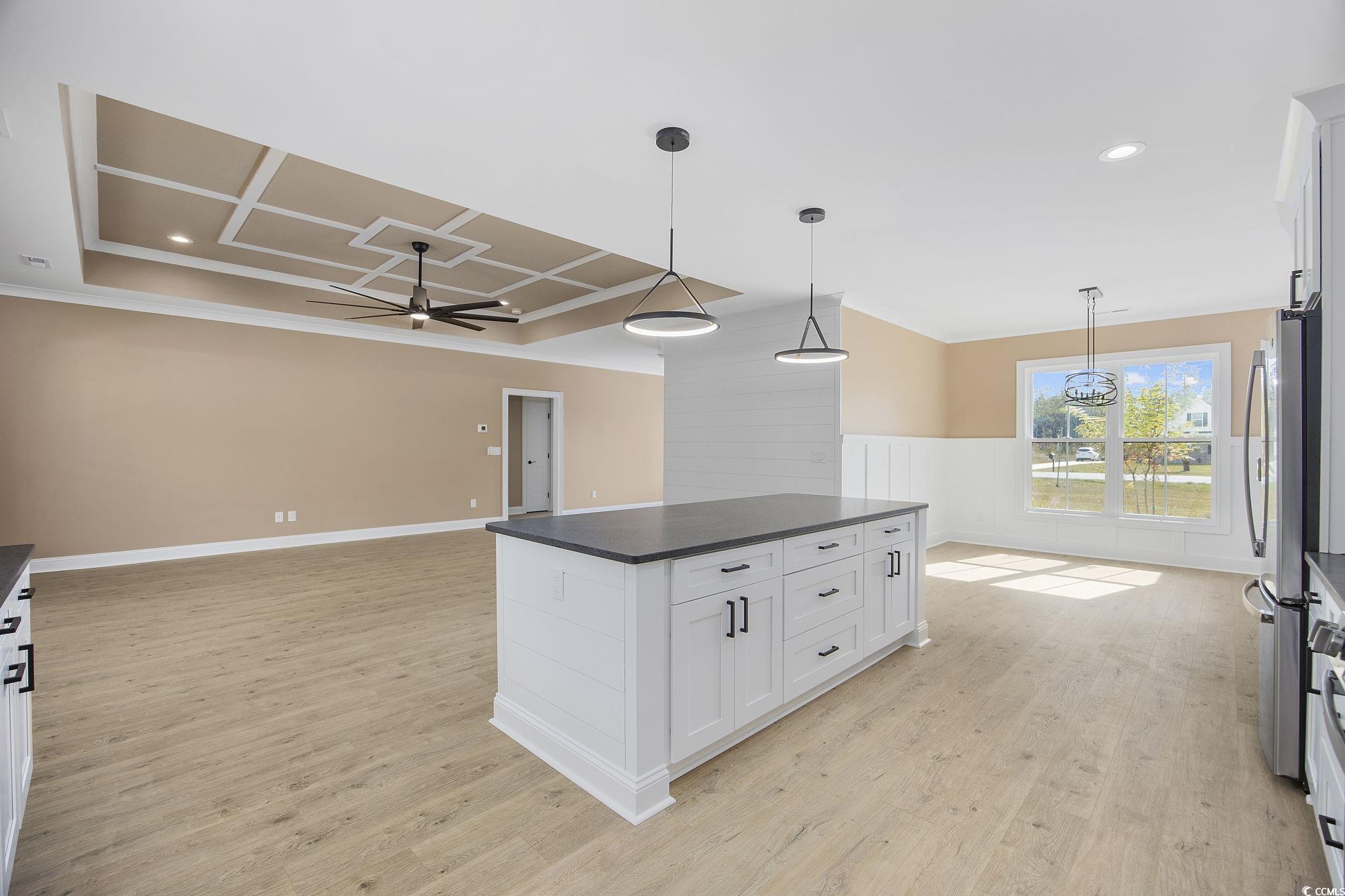 6914 Pauley Swamp Road Conway, SC 29527 - Photo 15 of 40 Kitchen with a kitchen island, ceiling fan, white
