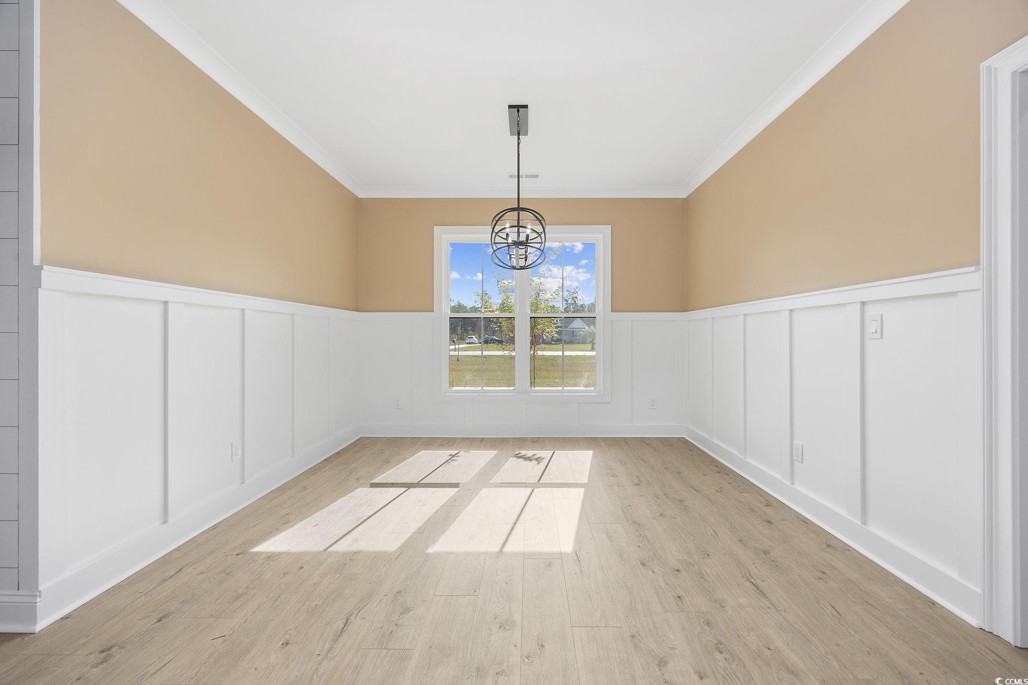 6914 Pauley Swamp Road Conway, SC 29527 - Photo 17 of 40 Empty room with light hardwood / wood-style floors