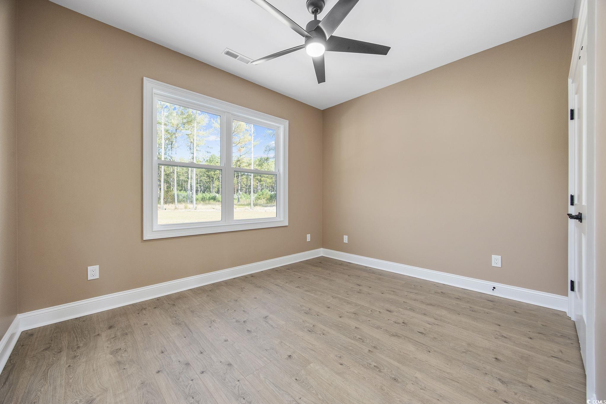 6914 Pauley Swamp Road Conway, SC 29527 - Photo 19 of 40 Spare room featuring light wood-type flooring and
