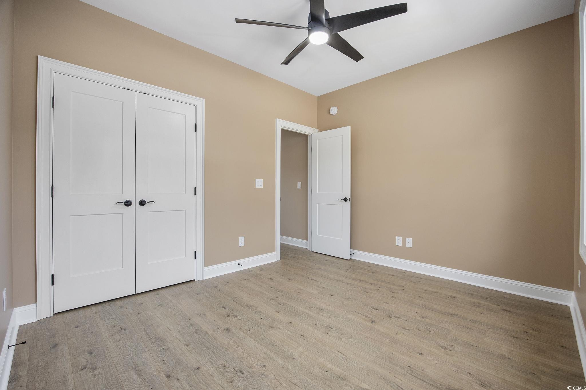 6914 Pauley Swamp Road Conway, SC 29527 - Photo 20 of 40 Unfurnished bedroom featuring a closet, ceiling fa