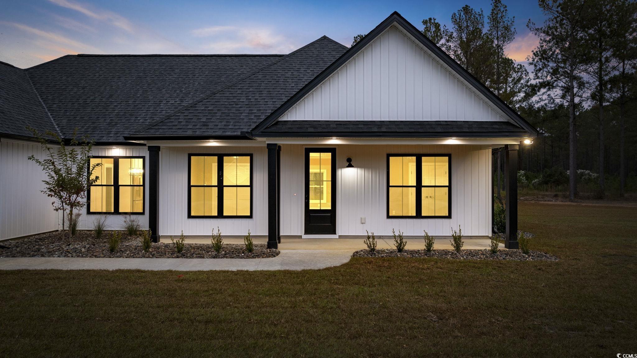 6914 Pauley Swamp Road Conway, SC 29527 - Photo 2 of 40 Modern inspired farmhouse with a yard