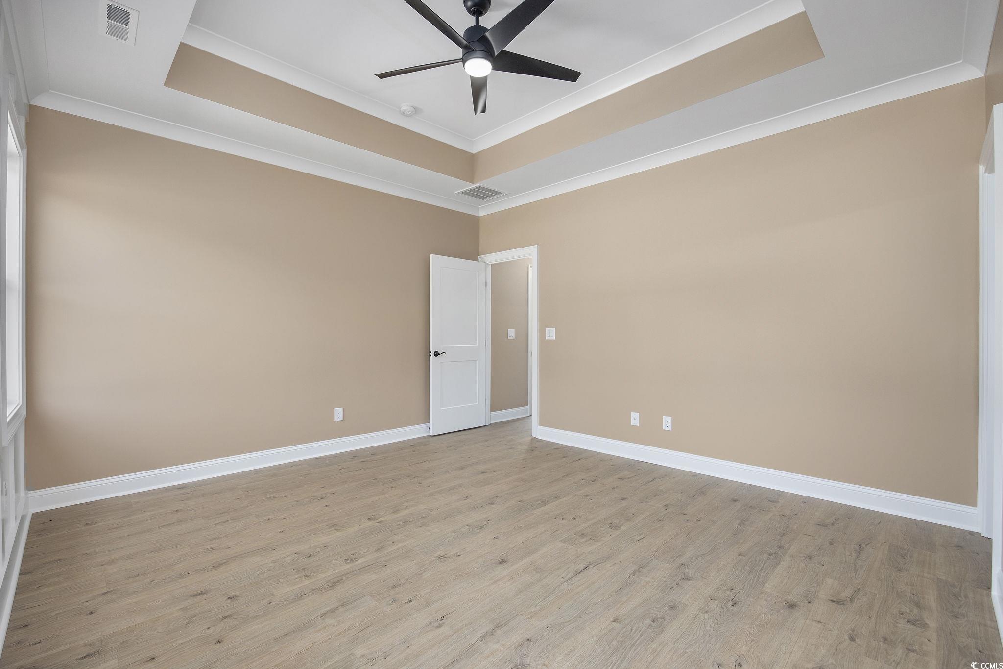 6914 Pauley Swamp Road Conway, SC 29527 - Photo 27 of 40 Empty room featuring crown molding, ceiling fan, l