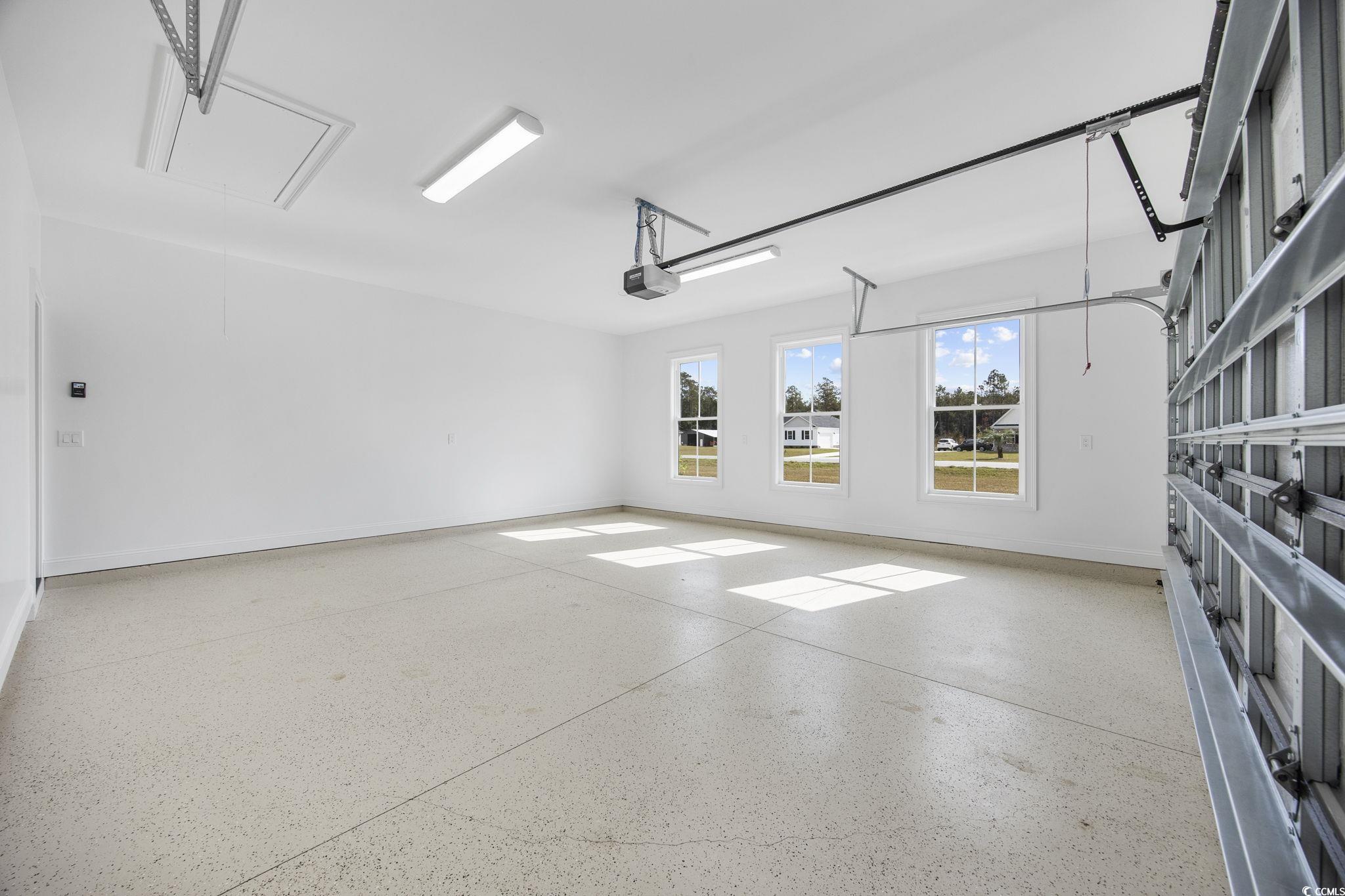 6914 Pauley Swamp Road Conway, SC 29527 - Photo 31 of 40 Garage featuring a garage door opener