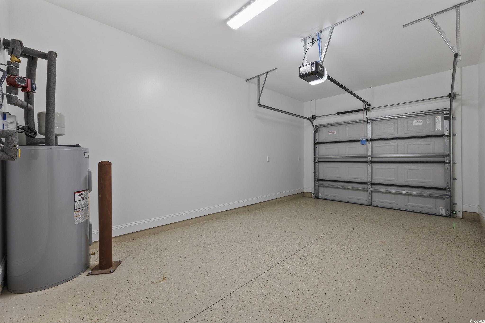 6914 Pauley Swamp Road Conway, SC 29527 - Photo 32 of 40 Garage with a garage door opener and electric wate