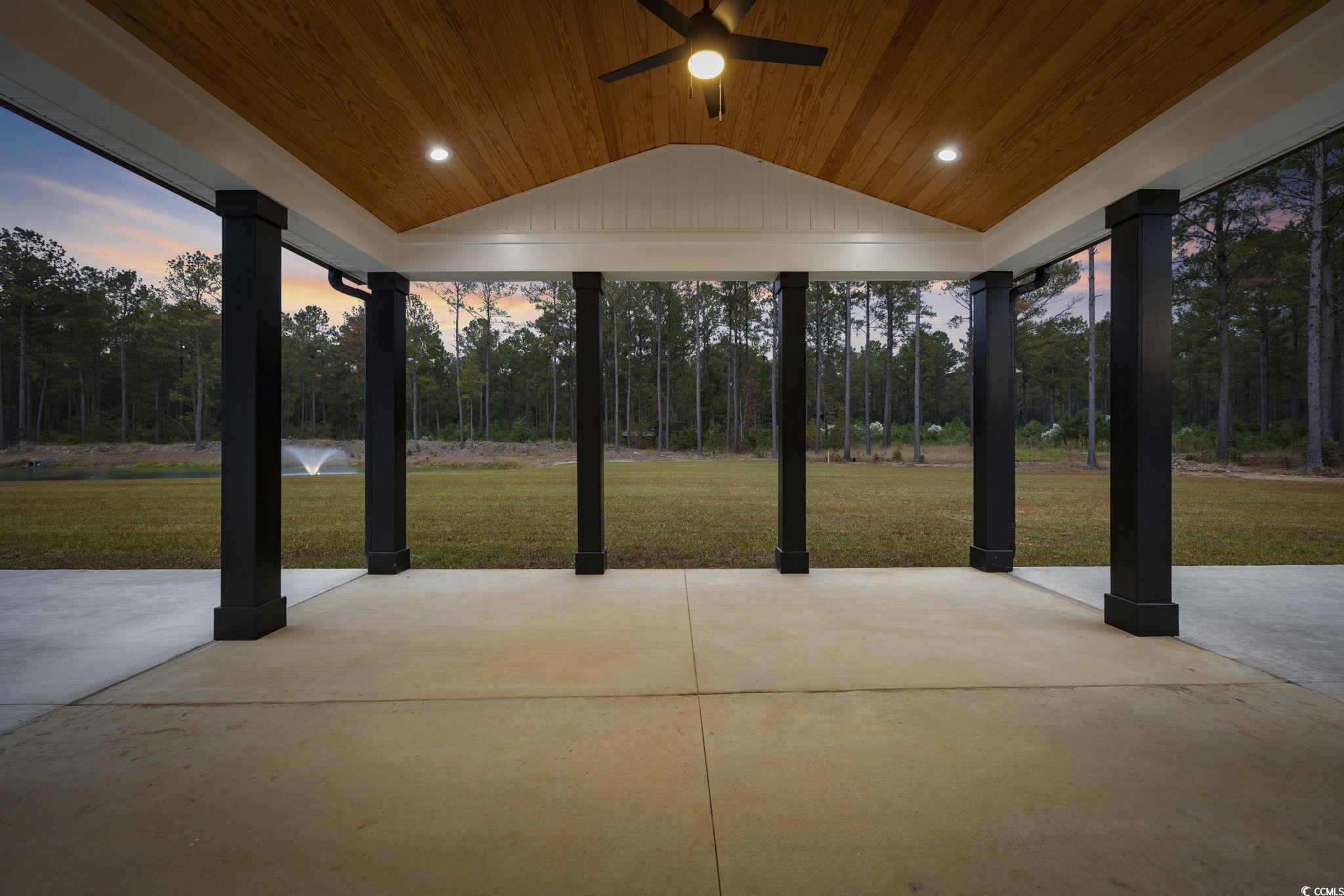 6914 Pauley Swamp Road Conway, SC 29527 - Photo 34 of 40 Patio terrace at dusk featuring a yard and ceiling