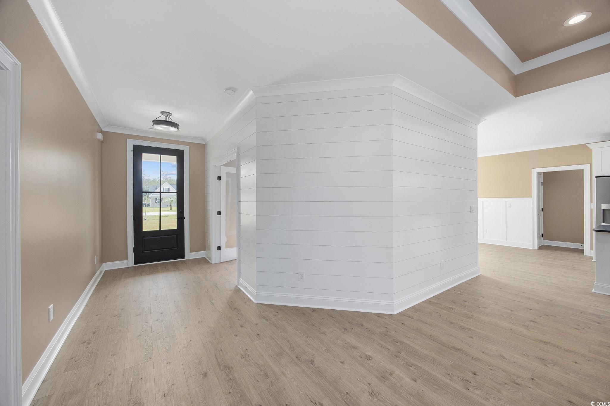 6914 Pauley Swamp Road Conway, SC 29527 - Photo 8 of 40 Entryway featuring ornamental molding and light wo