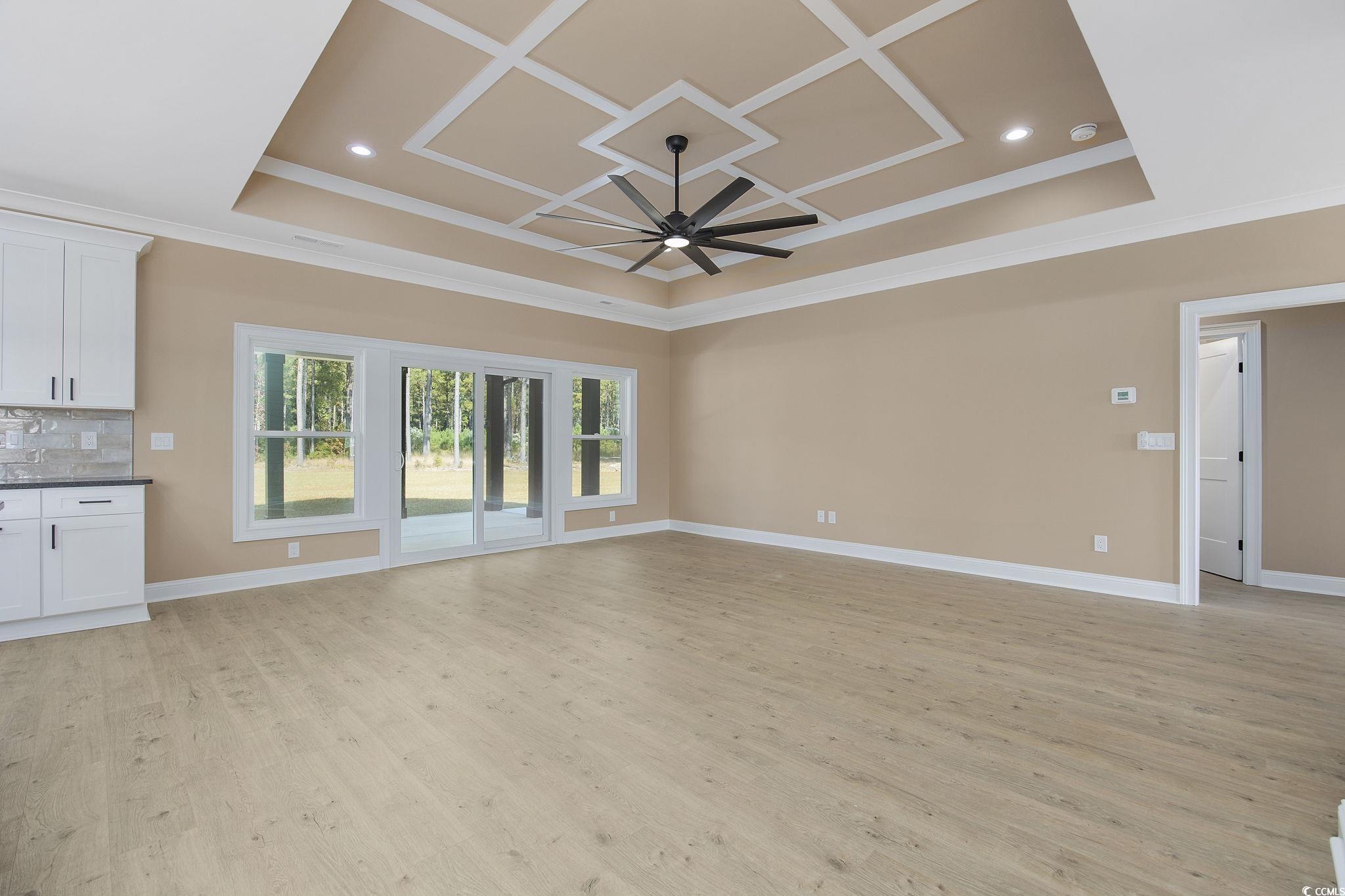 6914 Pauley Swamp Road Conway, SC 29527 - Photo 9 of 40 Unfurnished living room featuring ornamental moldi