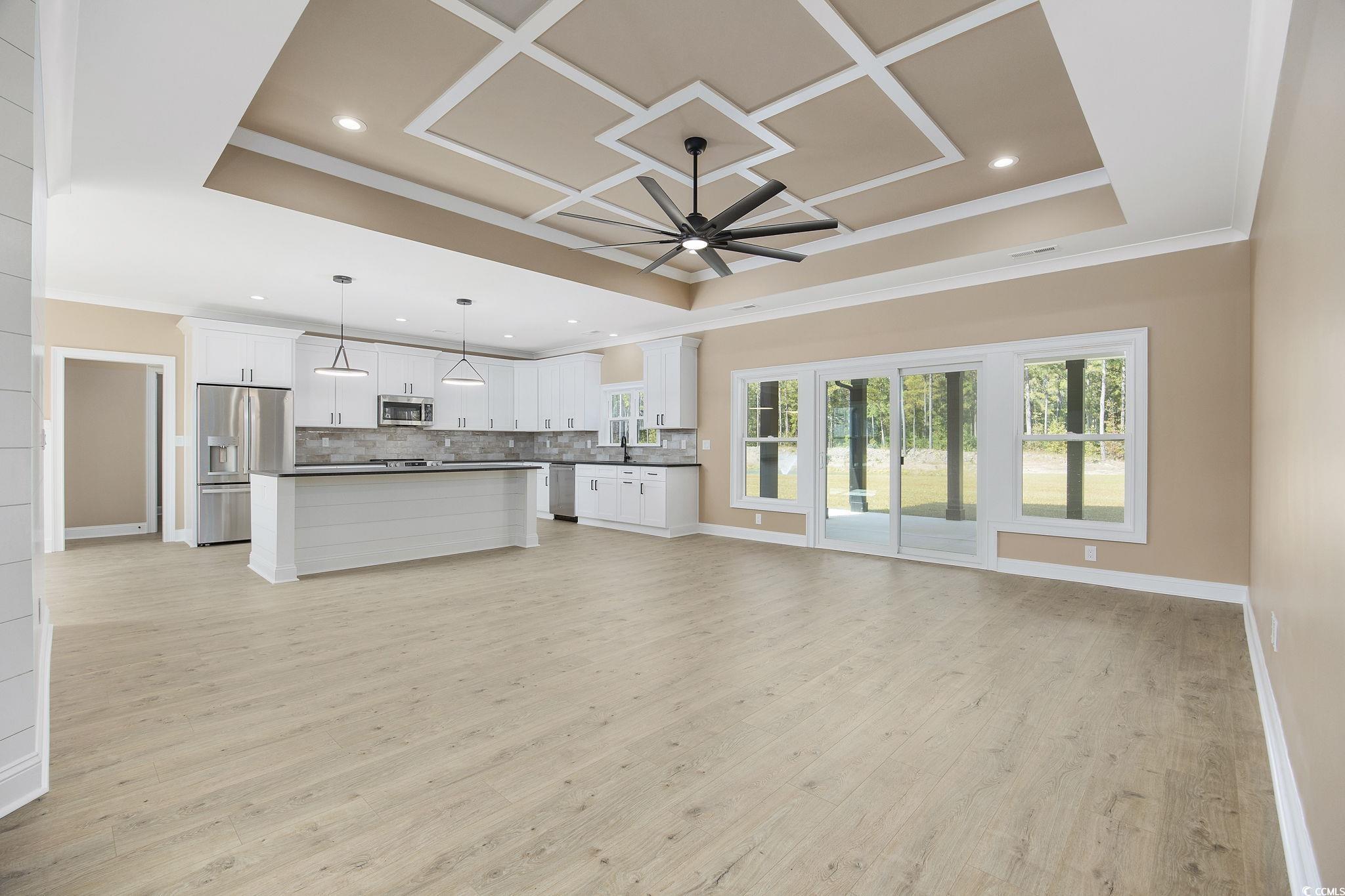 6914 Pauley Swamp Road Conway, SC 29527 - Photo 10 of 40 Unfurnished living room featuring ceiling fan, cro