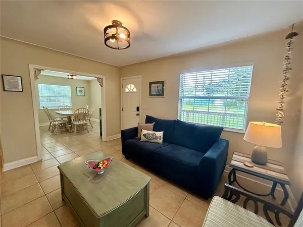 a living room with furniture and a window