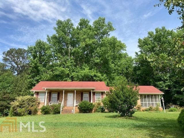 1381 Vineyard Road Griffin, GA 30223 - Photo 1 of 1 a front view of a house with a yard