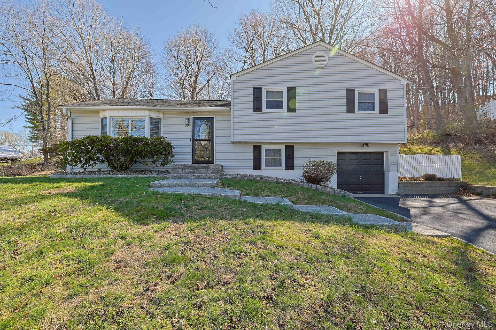 210 Varian Road Cortlandt Manor, NY 10567 - Photo 1 of 29 a front view of a house with a yard