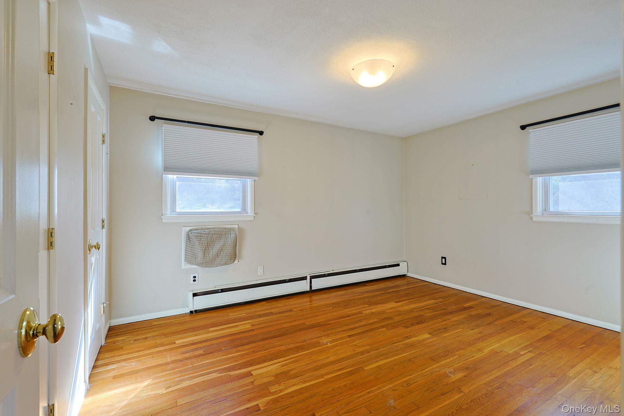 210 Varian Road Cortlandt Manor, NY 10567 - Photo 14 of 29 an empty room with windows