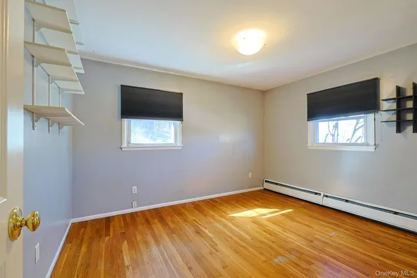 a view of a room with gym equipment and a window