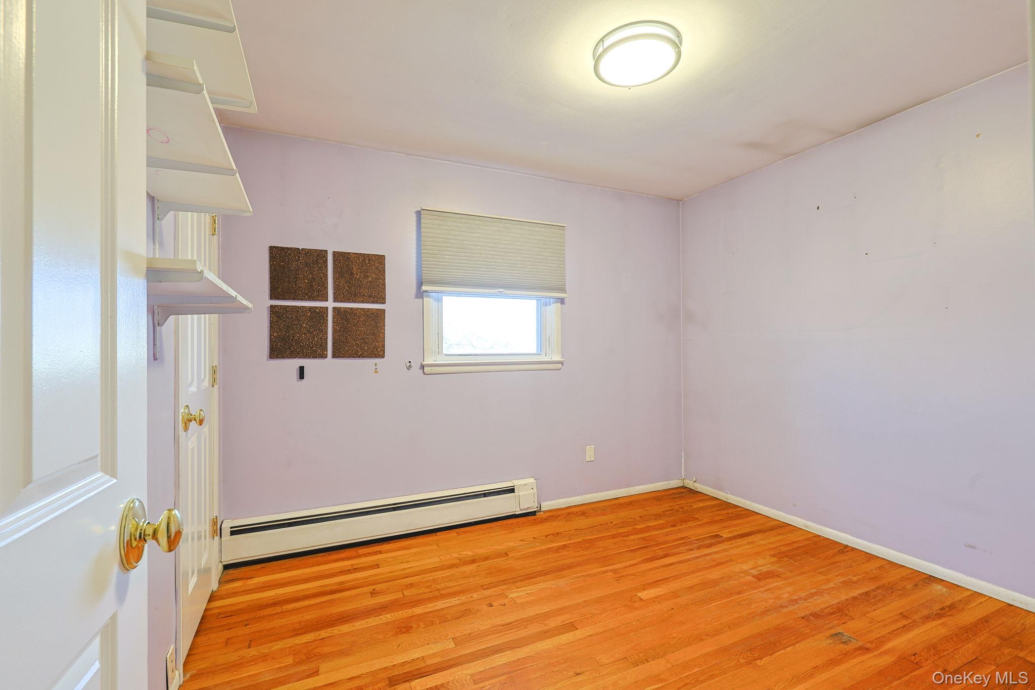 210 Varian Road Cortlandt Manor, NY 10567 - Photo 18 of 29 an empty room with windows