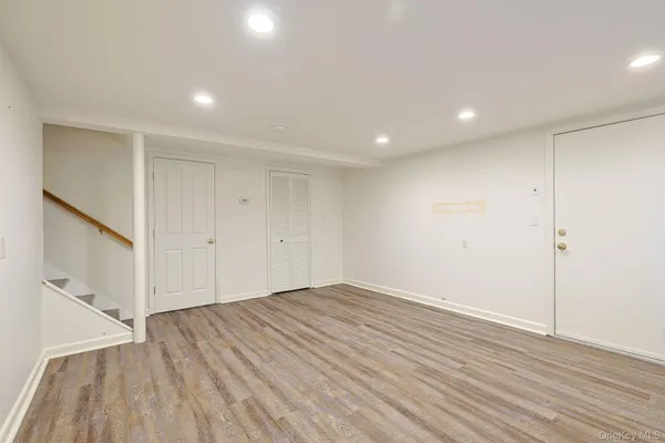 a view of room with wooden floor