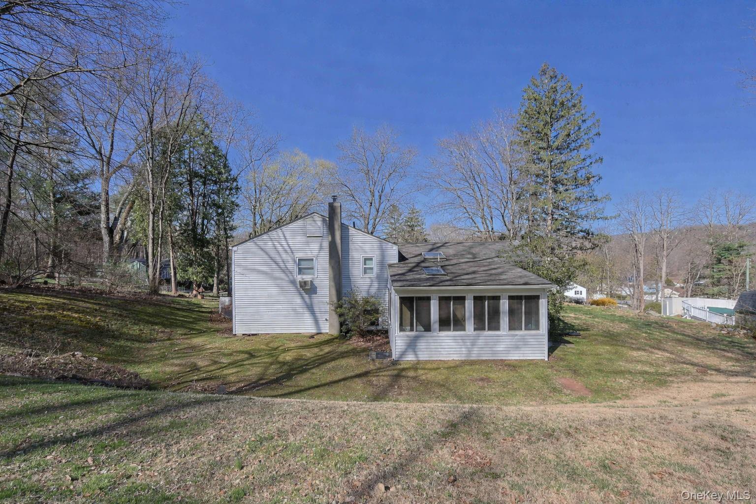 210 Varian Road Cortlandt Manor, NY 10567 - Photo 27 of 29 a view of a house with a yard