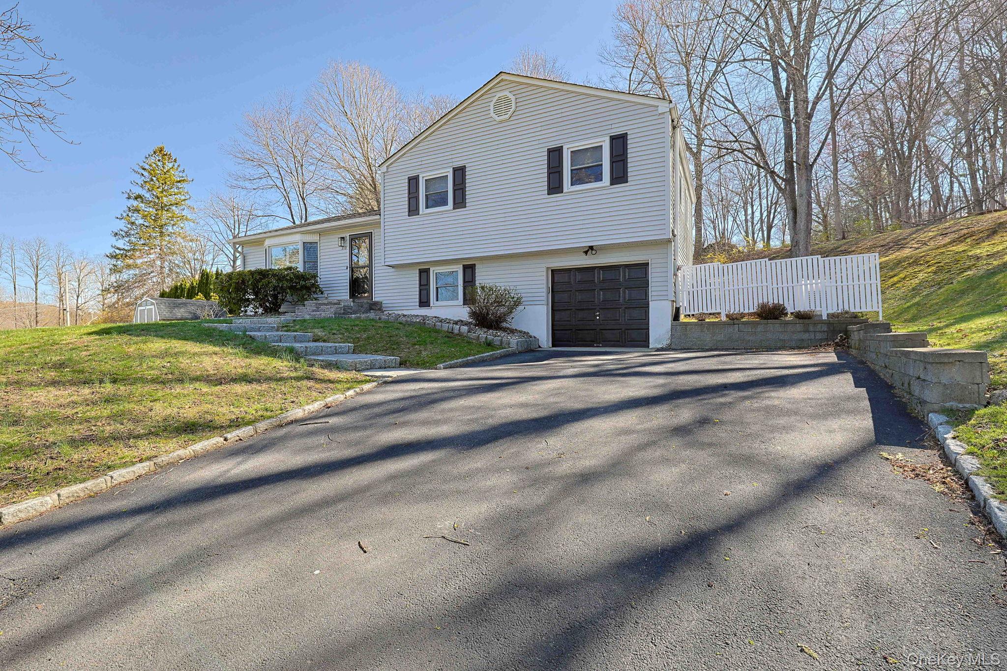210 Varian Road Cortlandt Manor, NY 10567 - Photo 3 of 29 a view of a house with a yard and pathway