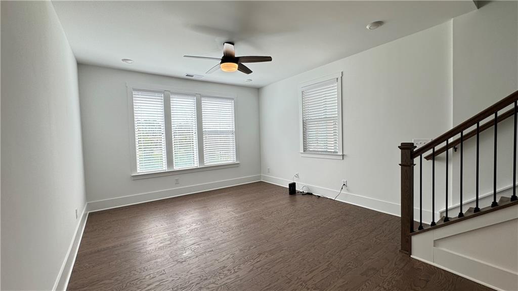 1585 Layton Lane Northwest Atlanta, GA 30318 - Photo 16 of 61 a view of an empty room with wooden floor and a window