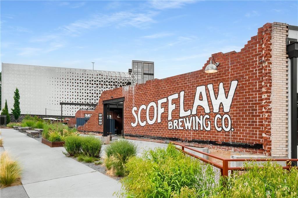 1585 Layton Lane Northwest Atlanta, GA 30318 - Photo 55 of 61 a view of a sign board with buildings in the background