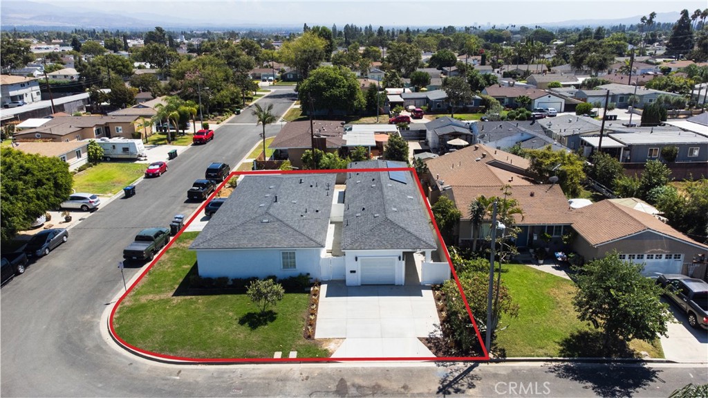 1056 Walter Avenue Tustin, CA 92780 - Photo 1 of 39 an aerial view of a house with a swimming pool