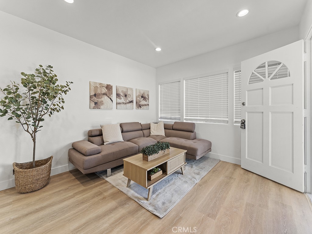 1056 Walter Avenue Tustin, CA 92780 - Photo 18 of 39 a living room with furniture and a potted plant