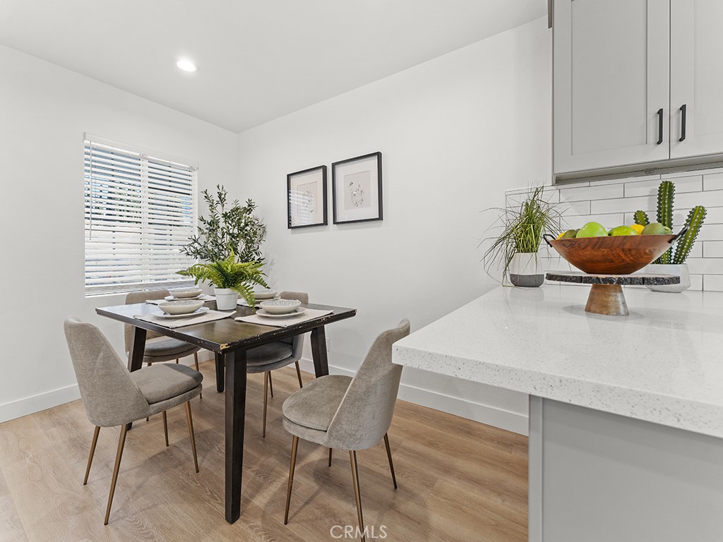 1056 Walter Avenue Tustin, CA 92780 - Photo 21 of 39 a view of a dining room with furniture and wooden floor