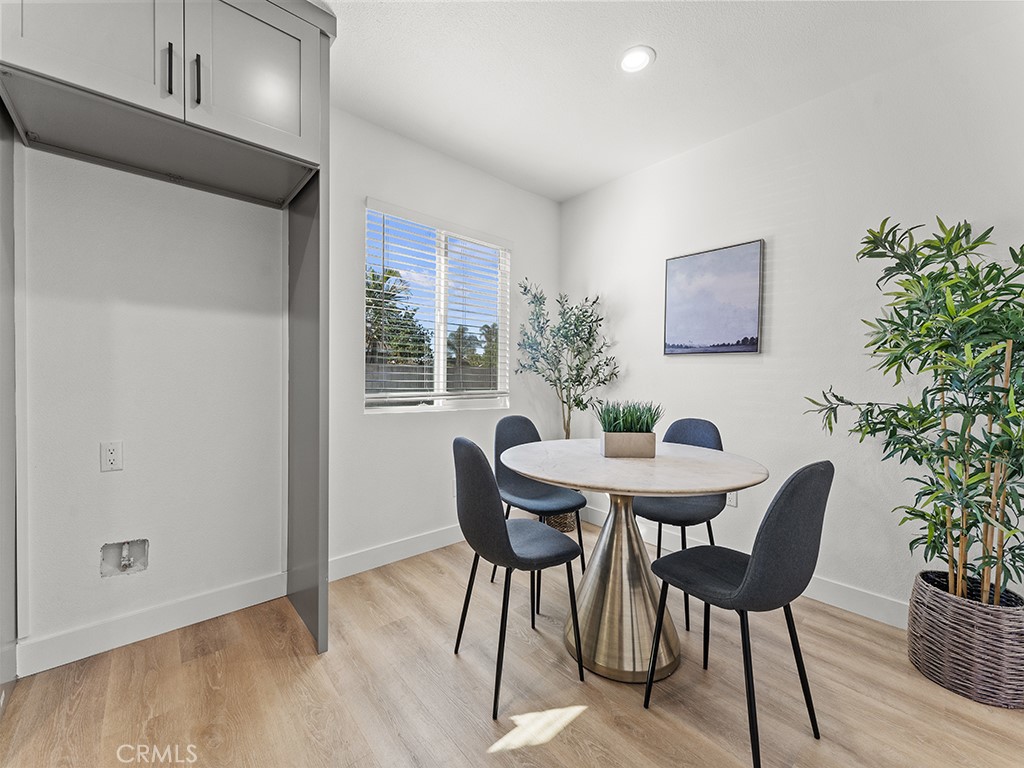 1056 Walter Avenue Tustin, CA 92780 - Photo 26 of 39 a view of a dining room with furniture and wooden floor