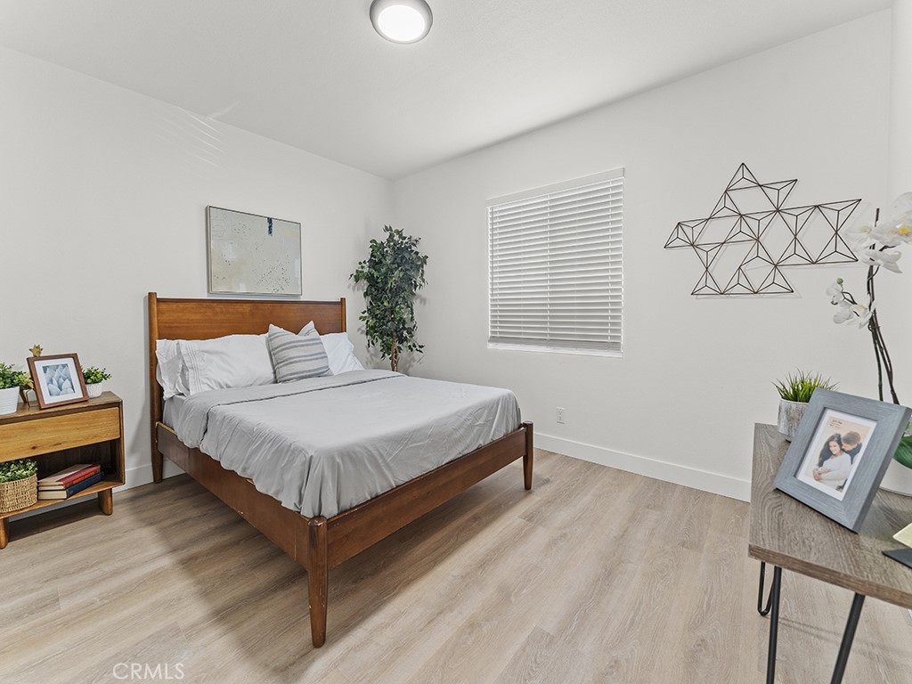 1056 Walter Avenue Tustin, CA 92780 - Photo 28 of 39 a bedroom with a bed and a window