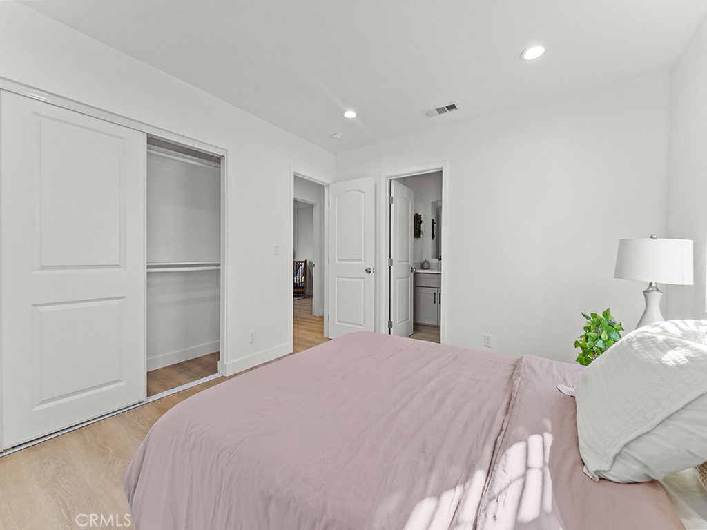 1056 Walter Avenue Tustin, CA 92780 - Photo 30 of 39 a bedroom with a bed and a closet