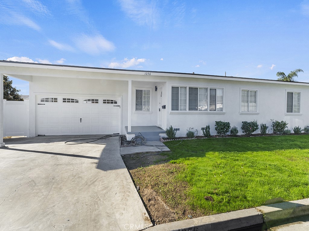 1056 Walter Avenue Tustin, CA 92780 - Photo 36 of 39 a front view of a house with garden