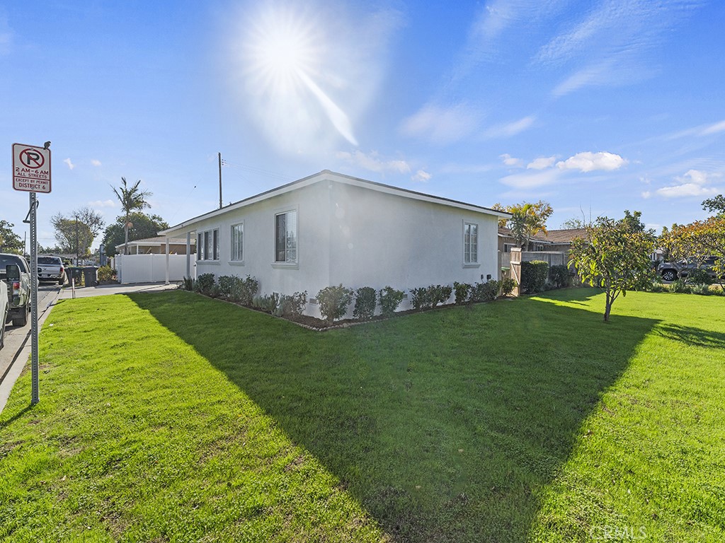 1056 Walter Avenue Tustin, CA 92780 - Photo 37 of 39 a backyard of a house with plants and large tree