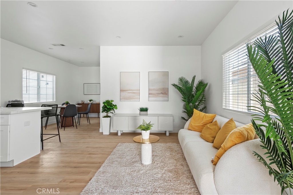 1056 Walter Avenue Tustin, CA 92780 - Photo 5 of 39 a living room with furniture and a large window