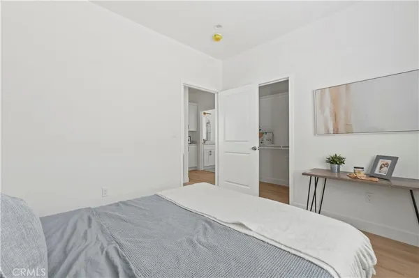 a bedroom with a bed and cabinets