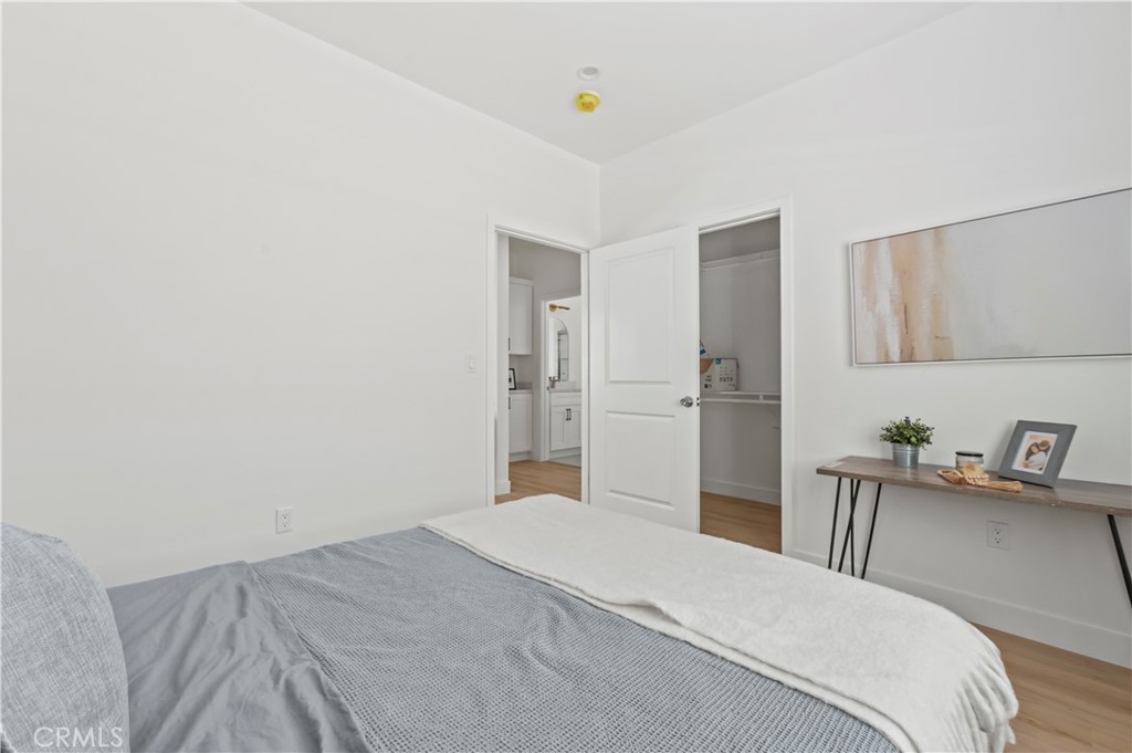 1056 Walter Avenue Tustin, CA 92780 - Photo 7 of 39 a bedroom with a bed and cabinets