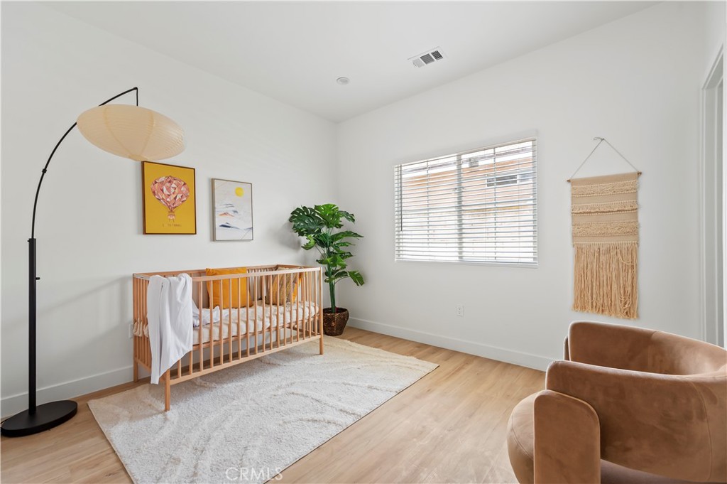 1056 Walter Avenue Tustin, CA 92780 - Photo 8 of 39 a bedroom with a bed and a window