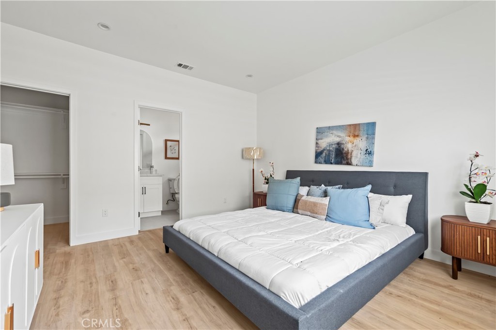 1056 Walter Avenue Tustin, CA 92780 - Photo 9 of 39 a bedroom with a bed and a night stand