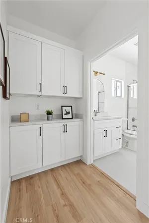 a view of cabinets and wooden floor