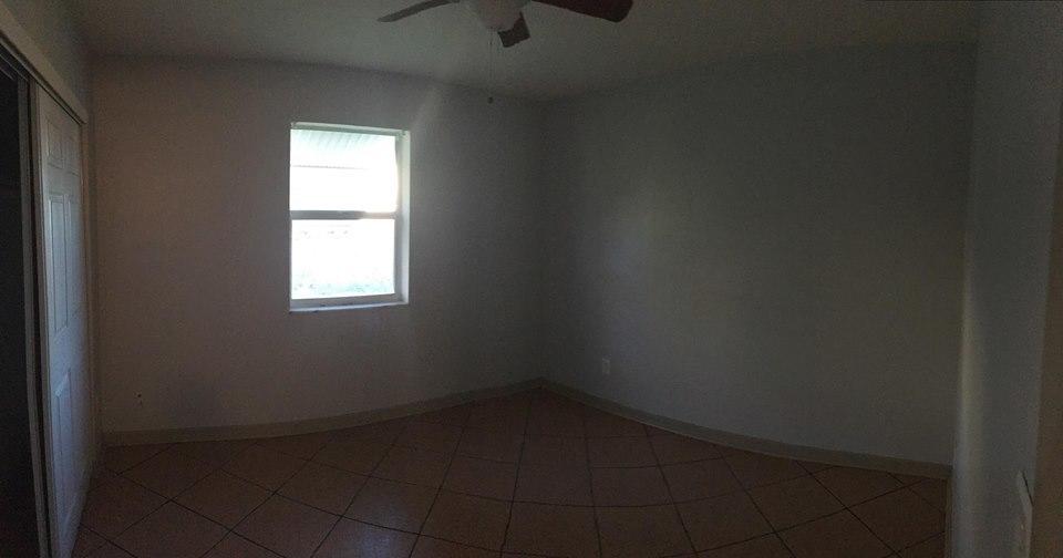 121 Southeast Bonita Court Port St. Lucie, FL 34983 - Photo 7 of 9 an empty room with a window