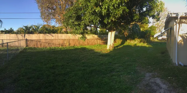 a view of backyard with green space