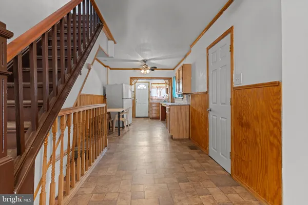 a bathroom with a toilet a sink and a window