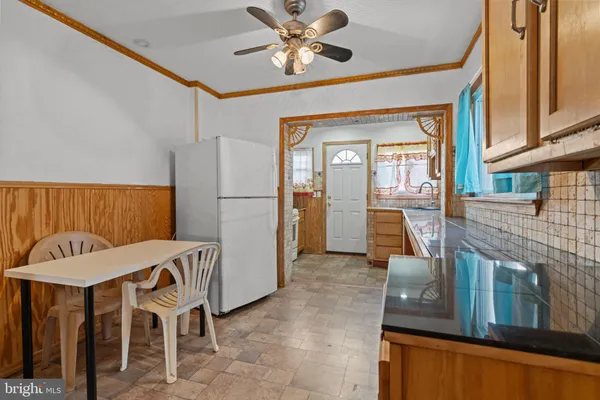a kitchen with a stove microwave and sink