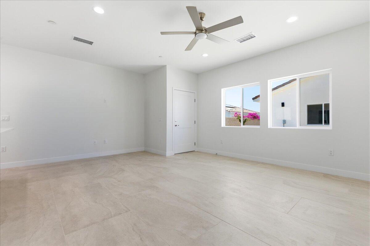 68160 Modalo Road Cathedral City, CA 92234 - Photo 40 of 57 an empty room with a ceiling fan and a ceiling fan