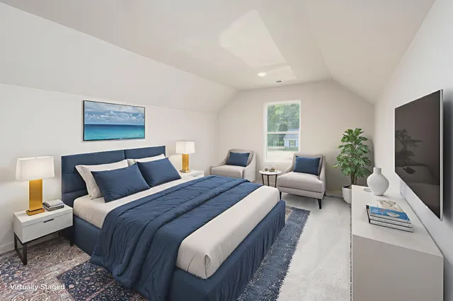 a hotel room with large bed and a couch