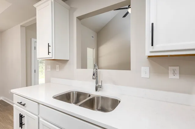 a close view of a sink and dishwasher in a kitchen