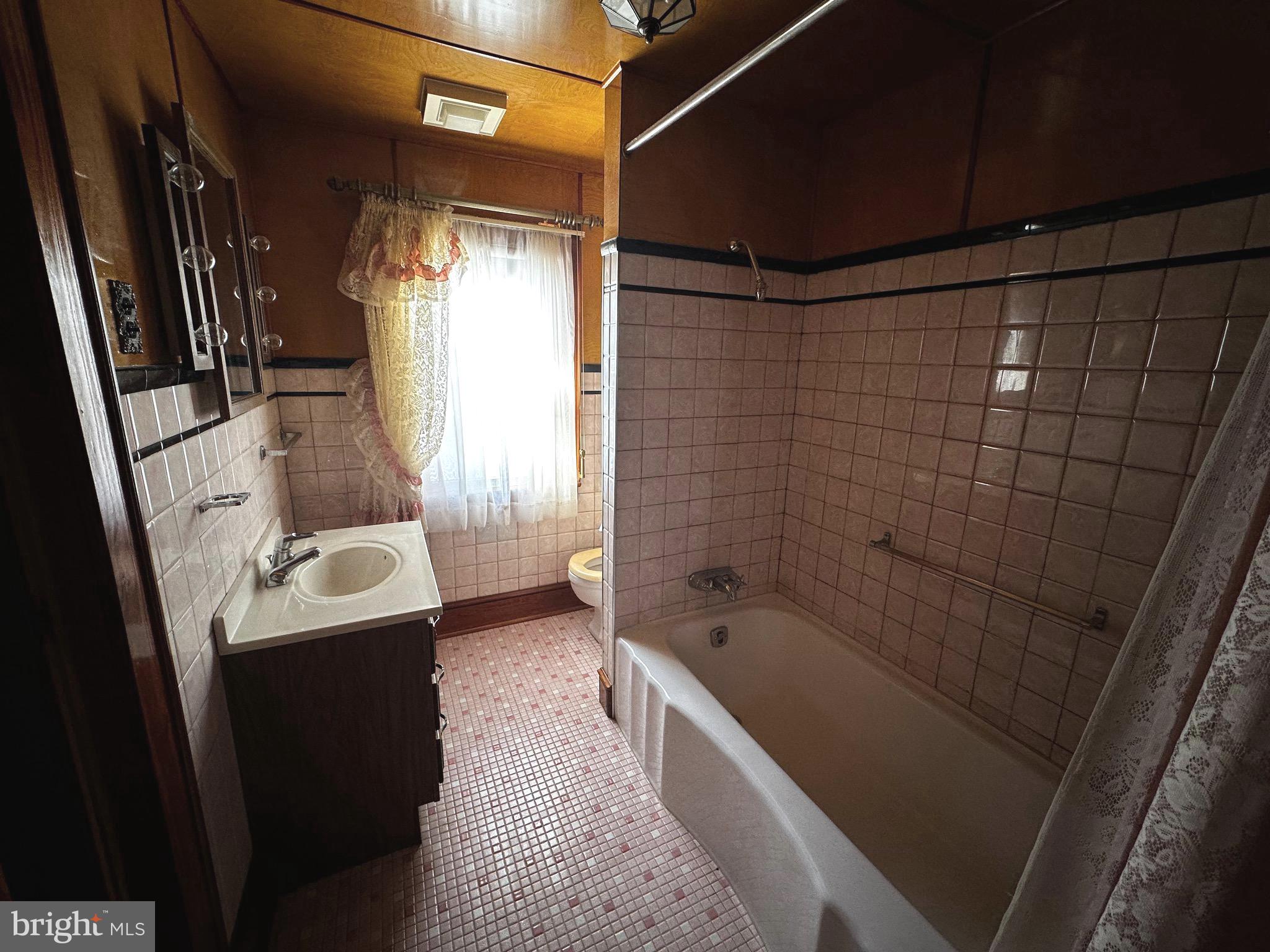 3500 Paw Paw Road Paw Paw, WV 25434 - Photo 20 of 48 a bathroom with a sink a toilet and shower